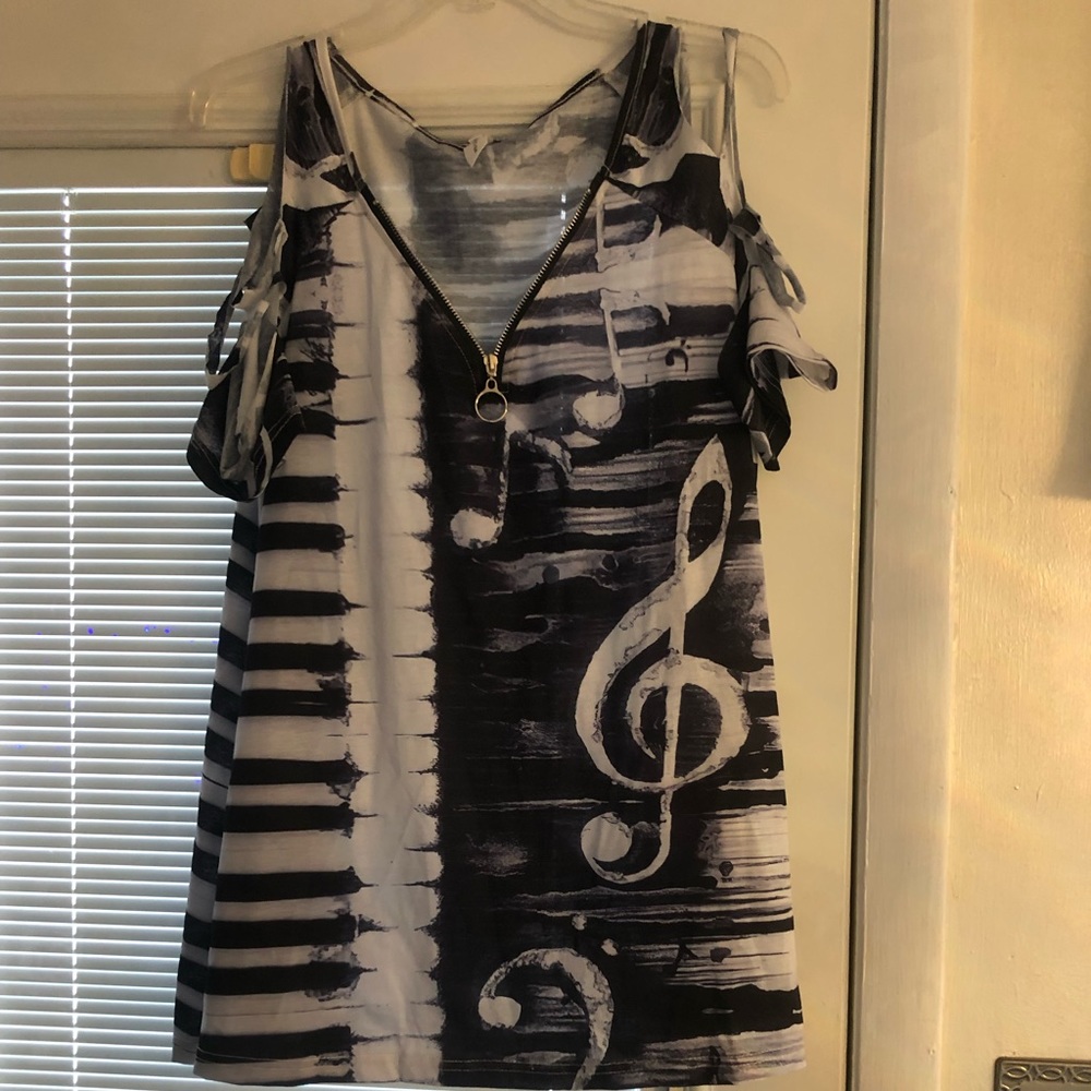 Lightweight cut sleeve blouse with music note and piano detail.  Never worn